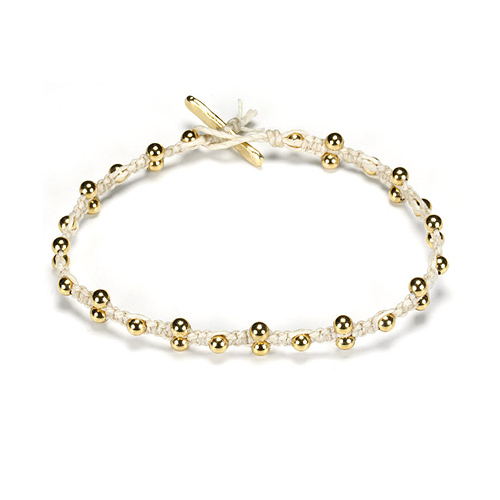 sparkle macrame bracelet with scattered brass beads on ivory irish linen