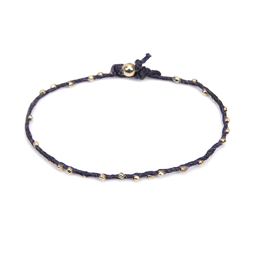 sparkle twisted strand gold dipped bracelet on navy irish linen