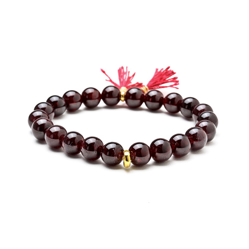 garnet stretch healing gem bracelet with berry tassel