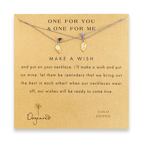 one for you one for me make a wish necklace set with gold dipped angel wings on ocean