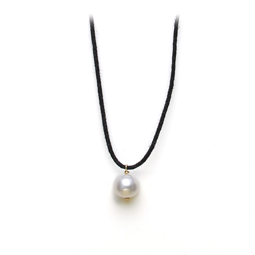 white pearl on black waxed cotton, gold dipped toggle closure