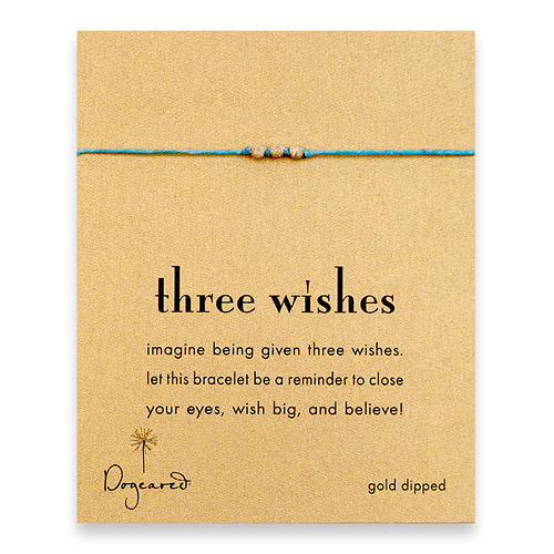 three wishes gold dipped stardust bead bracelet on turquoise irish linen