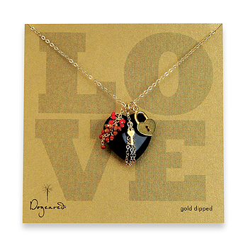 love large onyx heart gold dipped necklace with heart lock and key and gem clusters