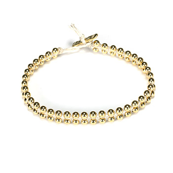 sparkle macrame bracelet with parallel brass beads on ivory irish linen