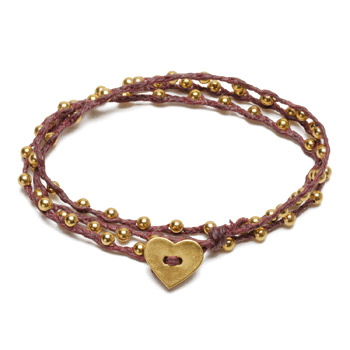 sparkle wrap bracelet with gold dipped heart closure on maroon irish linen