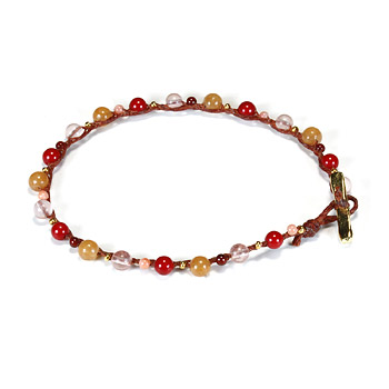 kitchen sink red multi bead single strand bracelet on rust irish linen