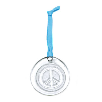 recycled glass peace ornament on light blue leather