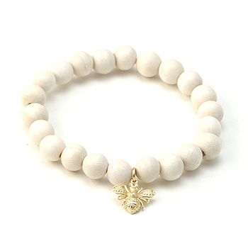 wood bracelet in ivory with gold dipped bee