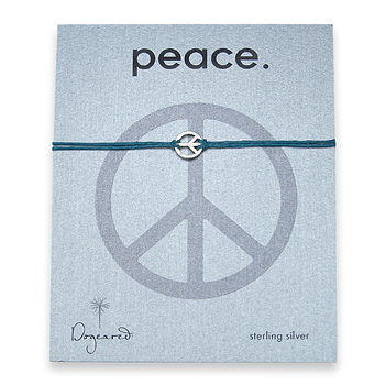 small peace bracelet sterling silver on teal irish linen small peace bracelet sterling silver on teal irish linen