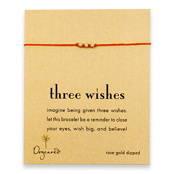 three wishes rose gold dipped stardust bead bracelet on burnt orange irish linen