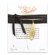 light as a feather large gold dipped feather necklace on leather
