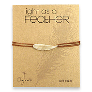 light as a feather medium gold dipped feather bracelet on tobacco irish linen