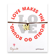 gold dipped love charm bracelet on tobacco irish linen