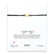 infinity gold dipped bracelet on black irish linen