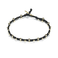 sparkle macrame bracelet with scattered brass beads on black irish linen