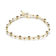 sparkle macrame bracelet with scattered brass beads on ivory irish linen