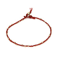 sparkle twisted strand gold dipped bracelet on red irish linen