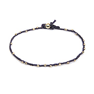 sparkle twisted strand gold dipped bracelet on navy irish linen