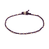 sparkle twisted strand gold dipped bracelet on plum irish linen