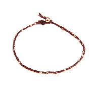 sparkle twisted strand rose gold dipped bracelet on maroon irish linen