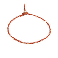 sparkle twisted strand rose gold dipped bracelet on burnt orange irish linen