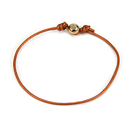 gold dipped peace bead bracelet on copper leather cord