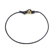 gold dipped peace bead bracelet on navy leather cord