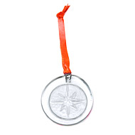 recycled glass north star ornament on orange leather