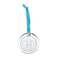 recycled glass fleur di lis ornament on light blue leather