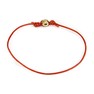 gold dipped peace bead bracelet on fire leather cord