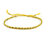 friendship bracelet with brass beads on lemon thread
