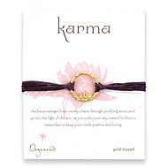 lotus karma gold dipped bracelet on plum irish linen