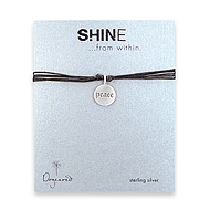 shine peace sterling silver bracelet on black irish linen