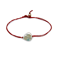 heart pearl bracelet on red irish linen