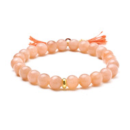 pink moonstone stretch healing gem bracelet with rust tassel