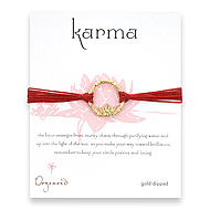 lotus karma gold dipped bracelet on red irish linen
