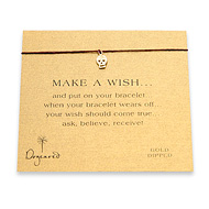 make a wish bracelet with gold dipped skull on maroon