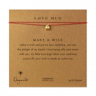 love bug ladybug necklace on red, gold dipped