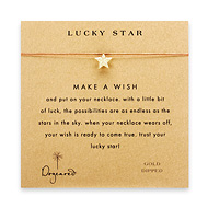 lucky star gold dipped make a wish necklace on orange