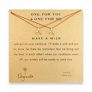 one for you one for me make a wish necklace set with gold dipped wishbone on tobacco