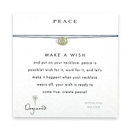 peace make a wish necklace with sterling silver peace sign on ocean