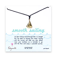 gold dipped smooth sailings necklace on black waxed cotton