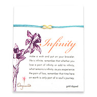small gold dipped infinity bracelet on turquoise irish linen