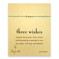 three wishes gold dipped stardust bead bracelet on turquoise irish linen