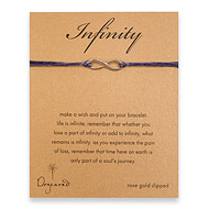 large rose gold dipped infinity bracelet on plum irish linen