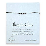three wishes charcoal stardust bead bracelet on black irish linen